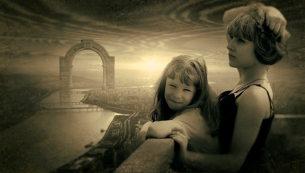 Mother and daughter with a misty, river in the background running through a stone arch at sunrise. 